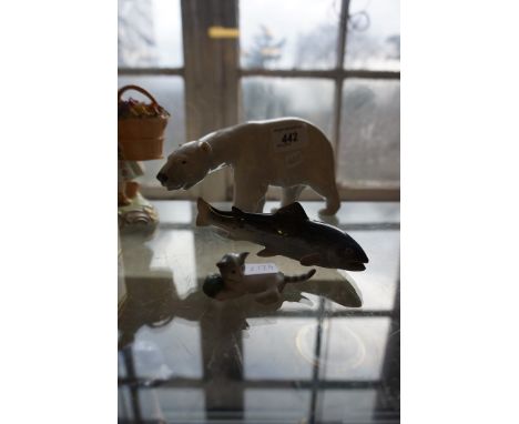 Two Royal Copenhagen/Bing & Grondahl to include a polar bear and fish together with a ceramic model of a cat.