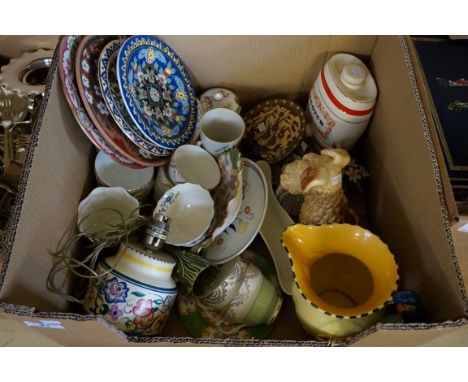 A mixed lot of assorted ceramics to include Poole Pottery floral decorated table lamp and matching plate, Sylvac dog, etc.