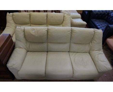 A good quality modern cream leather four piece suite, comprising two three seater sofas, armchair and matching pouffe.