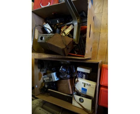 A large quantity of assorted cameras and equipment to include Kodak Pyramid safe light lamp, large lens, box brownie camera, 