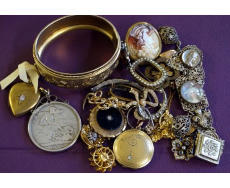 A seed pearl and yellow metal brooch, in the form of a bow, together with, a paste crescent brooch, a base metal heart locket