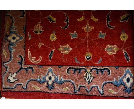 A hand made Bokahara rug on a mainly red ground 
The central panel with florally decorated lozenge, flanked by floral decorat