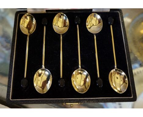 A cased set of Birmingham hallmarked silver and yellow enamel teaspoons. 