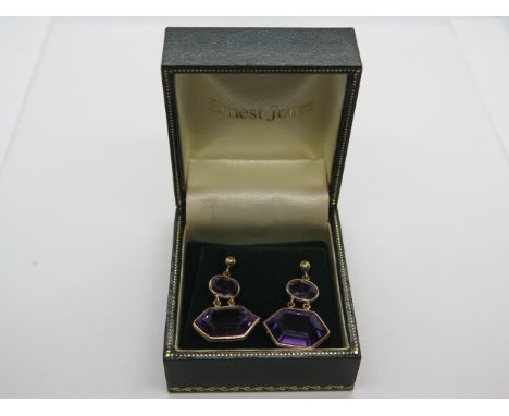 A large pair of 18ct gol and amethyst drop earrings stamped 750 and with Italian hallmarks for 18ct gold, the largest stone m