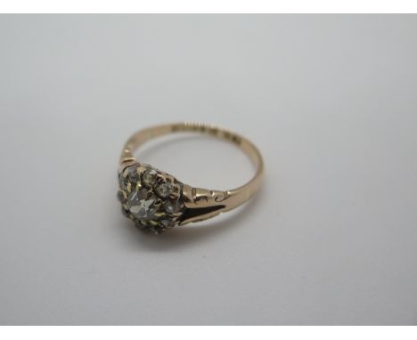 An antique 9ct gold diamond cluster ring, hallmarked Chester - central diamond measures approx 0.45ct, surrounded by ten smal