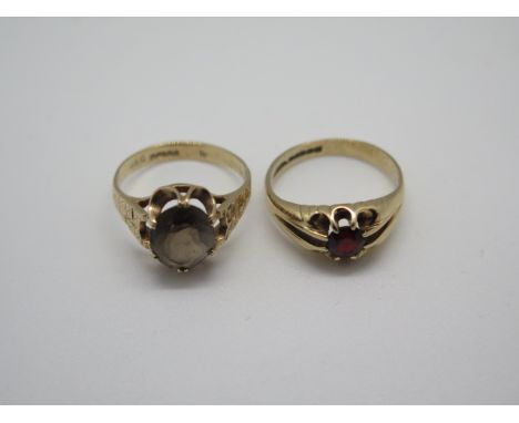 A 9ct gold smokey quartz ring and a 9ct garnet ring both hallmarked and size M, total weight approx 5.6 grams, both generally