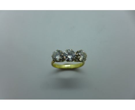 A diamond three stone ring, three round brilliant cut diamonds, centre diamond measuring approx 5.46mm x 5.50mm - diameter x 