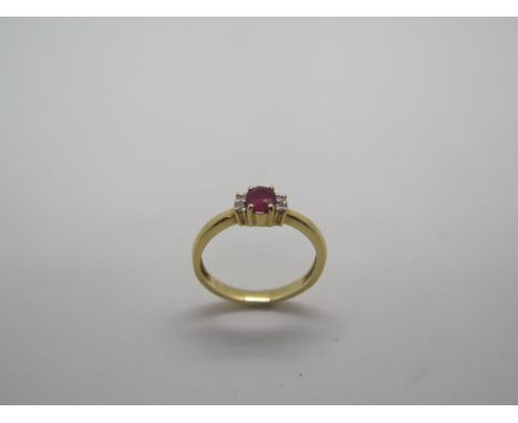 A 9ct yellow gold ruby and diamond rig, size J/K approx 2.2 grams, ruby has not been tested to be natural but registers on th