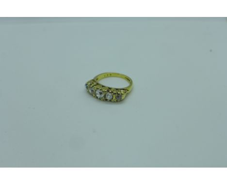 An 18ct hallmarked five stone diamond ring, size K, central diamond approx 0.30ct, diamonds bright, some small usage wear 