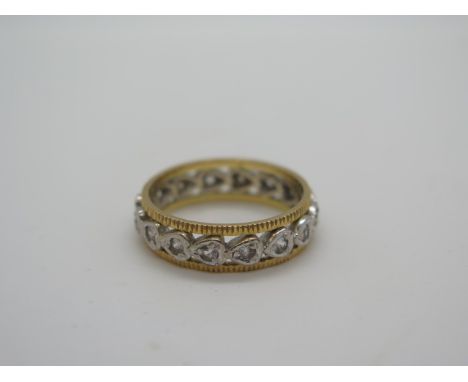 An antique 18ct yellow and white gold eternity style ring, size M, set with small white stones - 4.2 grams&nbsp;