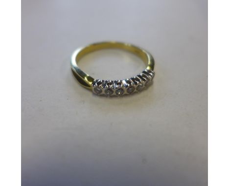 An 18ct yellow gold, seven stone diamond ring, size Q, approx 3.1 grams - in generally good condition 