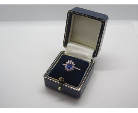 An 18ct white gold sapphire and diamond ring, size L, approx 2.6 grams, head approx 10x8mm - in good condition, marked 18K 