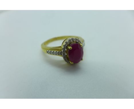 An 18ct yellow gold diamond and ruby ring, size P/Q, approx 8x6x4.5mm, in generally good condition 