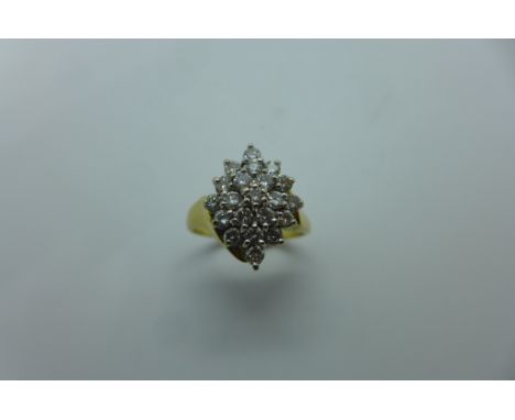 A diamond marquise shaped multi-tier cluster ring, the marquise shaped cluster comprising a total of twenty-one round brillia