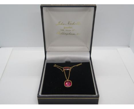 A 9ct gold and rubelite or synthetic ruby pendant, chain length 42cm, weight approx 3.7 grams, clean condition 