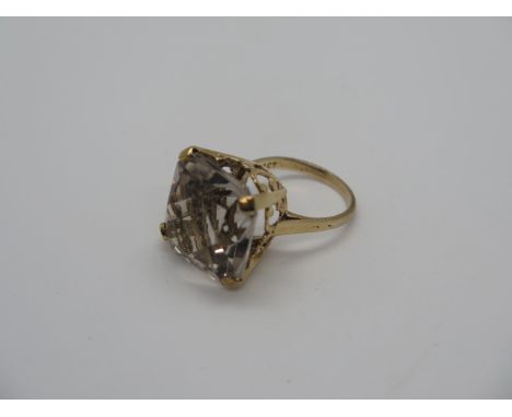 A large 9ct gold and quartz ring, the stone measures approx 17mm x 17mm - ring size O, stamped 9ct, weight 9.2 grams, conditi