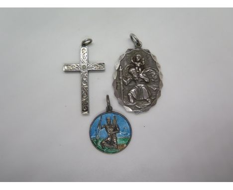 A large Georg Jensen St Christopher pendant, a silver white stone set cross and silver enameled St Christopher, some loss to 