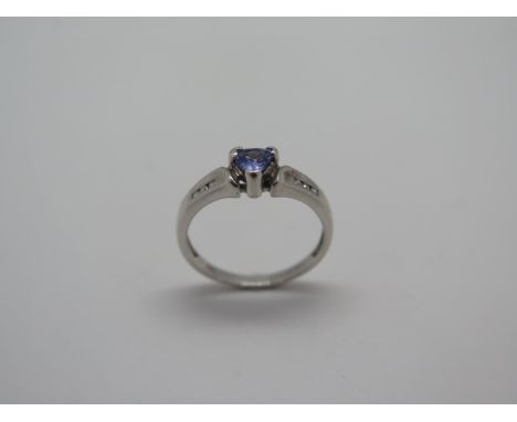 A 9ct hallmarked white gold tanzanite and diamond ring, size M, approx 2 grams, in good condition 
