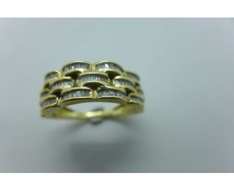 A 9ct gold and baguette cut diamond band ring, set with three rows of stones, ring size O, weight approx 4 grams, with diamon