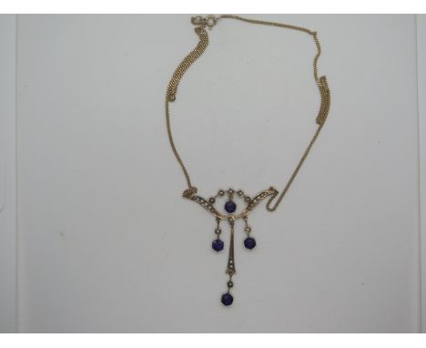 A very pretty Edwardian style amethyst and seed pearl Art Nouveau necklace set with four amethyst stones on droppers, the fra