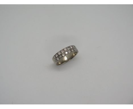 An 18ct white gold two row diamond ring, marked 18ct, ring size P/Q, approx 5.6 grams, diamonds bright, some light usage mark
