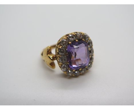 A yellow gold amethyst and diamond ring set with fourteen diamonds, head approx 15x14mm, ring size K/L, tests as approx 8.6 g
