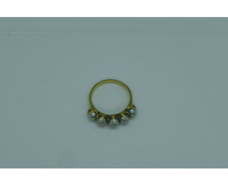 A yellow gold pearl ring, size L, approx 3.6 grams, tests to approx 18ct, not hallmarked, generally good 