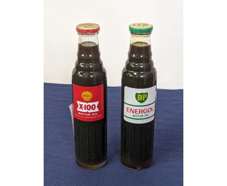A BP Energol Motor Oil bottle, SAE20W, half quart bottle with contents; together with a Shell X-100 motor oil bottle 20/20 W,