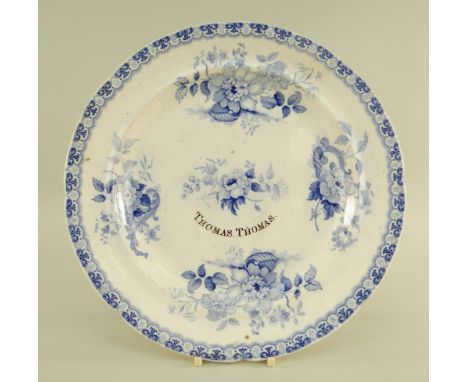 A SWANSEA DILLWYN POTTERY PLATE FOR THOMAS THOMAS in a light blue transfer pattern known as 'Shells and Flowers' with five de