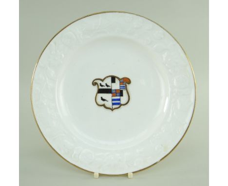 SWANSEA PORCELAIN PLATE having moulded floral borders, gilt rims and centred painted and gilded crests for the arms of Manner