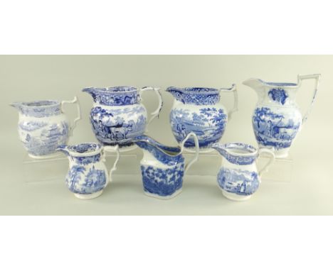 SEVEN VARIOUS SWANSEA POTTERY BLUE &amp; WHITE TRANSFER JUGS comprising  (1) 'Drover' example with acanthus spout and handle 