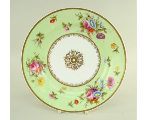 A SWANSEA PORCELAIN PLATE WITH LIME GREEN RESERVE BORDER painted with sprays of flowers and scattered sprigs within a solid g