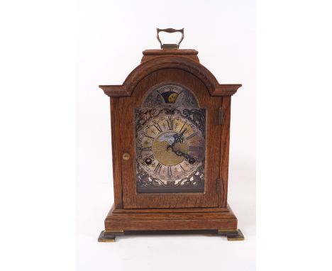 An early 20th century oak cased bracket clock with moon phase dial, eight day movement, 28cm high