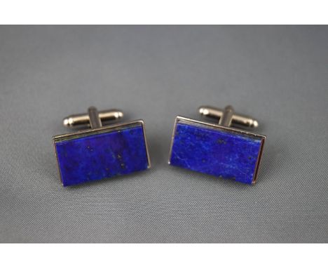 A boxed set of Lapis Lazuli cufflinks with T bar fitting. Tests indicate base metal (silver plated) 17.7 grams