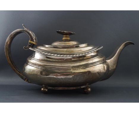 A George IV silver tea pot, of boat form with flowerhead finial, on four ball feet, by John James Keith, London 1826, 581 gra