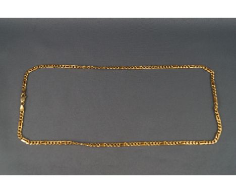 A yellow metal curb/figaro chain, trigger clasp, 510mm. Stamped 585 for 14ct gold. 16.2 grams
