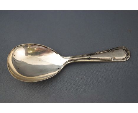 A silver caddy spoon, with ribbon and flower head handle, Sheffield 1944, 15 grams