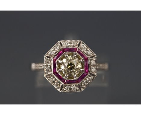 A white metal ruby and diamond halo cluster having a central old cut diamond, approx 0.58ct Colour M/N (tinted yellow) Clarit