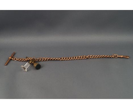 A rose gold Albert chain with two seal fobs attached, T bar and swivel clasp. Stamped 9C for 9ct gold. 24.6 grams