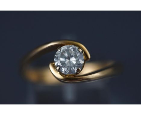 A yellow metal single stone diamond ring. Stated as 1.01ct Colour J/K Clarity: SI2/I1 Stamped 750 for 18ct gold. Size W1/2 6.