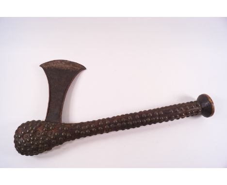 An African axe with wooden brass studded handle, 40cm long