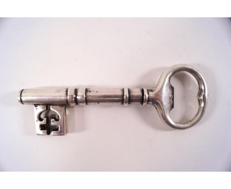 An early 20th century silver plated key corkscrew bottle opener, with a steel spiral worm, 14cm long (closed), 5.5 inches