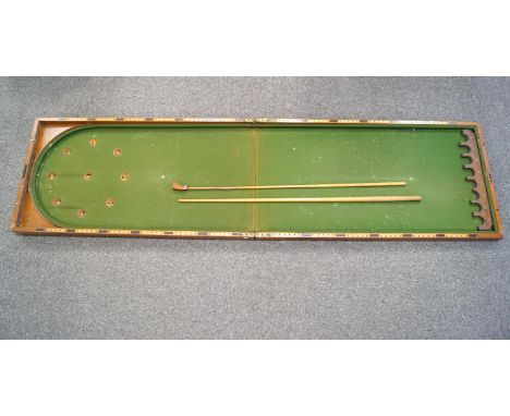 An Edwardian mahogany bar billiards with cues, mace and ivory balls, the folding case 106cm long, 56cm wide and 113cm deep