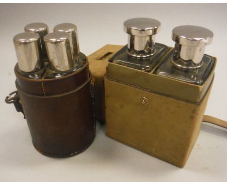 A vintage leather cased travelling flask set of circualr form containing four flasks, together with a further leather cased t