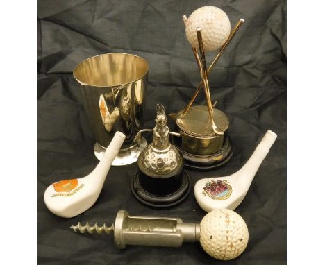 A collection of various golfing memorabilia including a silver trophy as a seated rabbit with golf club, a golf ball decorate