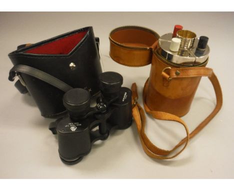 A pair of Pentax binoculars, together with three drinking flasks and four miniature cups, housed in a leather case and a antl