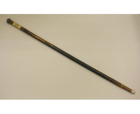 A sword stick with carved bone decorated handle