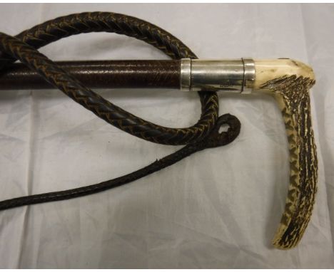 A ladies / gentleman's riding crop with antler handle and button inscribed "Watt Edinburgh", silver ferrule and plaited leath