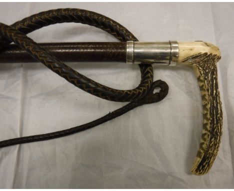 A ladies / gentleman's riding crop with antler handle and button inscribed "Watt Edinburgh", silver ferrule and plaited leath