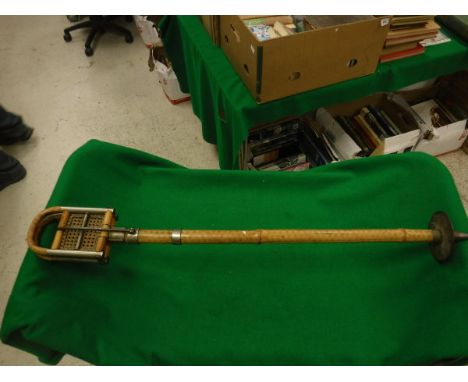 A Continental bamboo and caned shooting stick, a Field shooting stick and a game bird shooting stick with integral umbrella